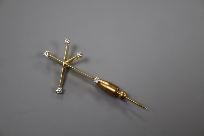 A 20th century yellow metal and diamond set Southern Cross constellation stick pin, 57mm, gross 4.9 grams.